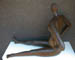 Female, black, seated, piece no. 1. Partial.